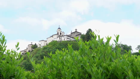 a view from the distance of the sacred mountain of varallo, a christian devotional complex, a unesco world heritage si in italy