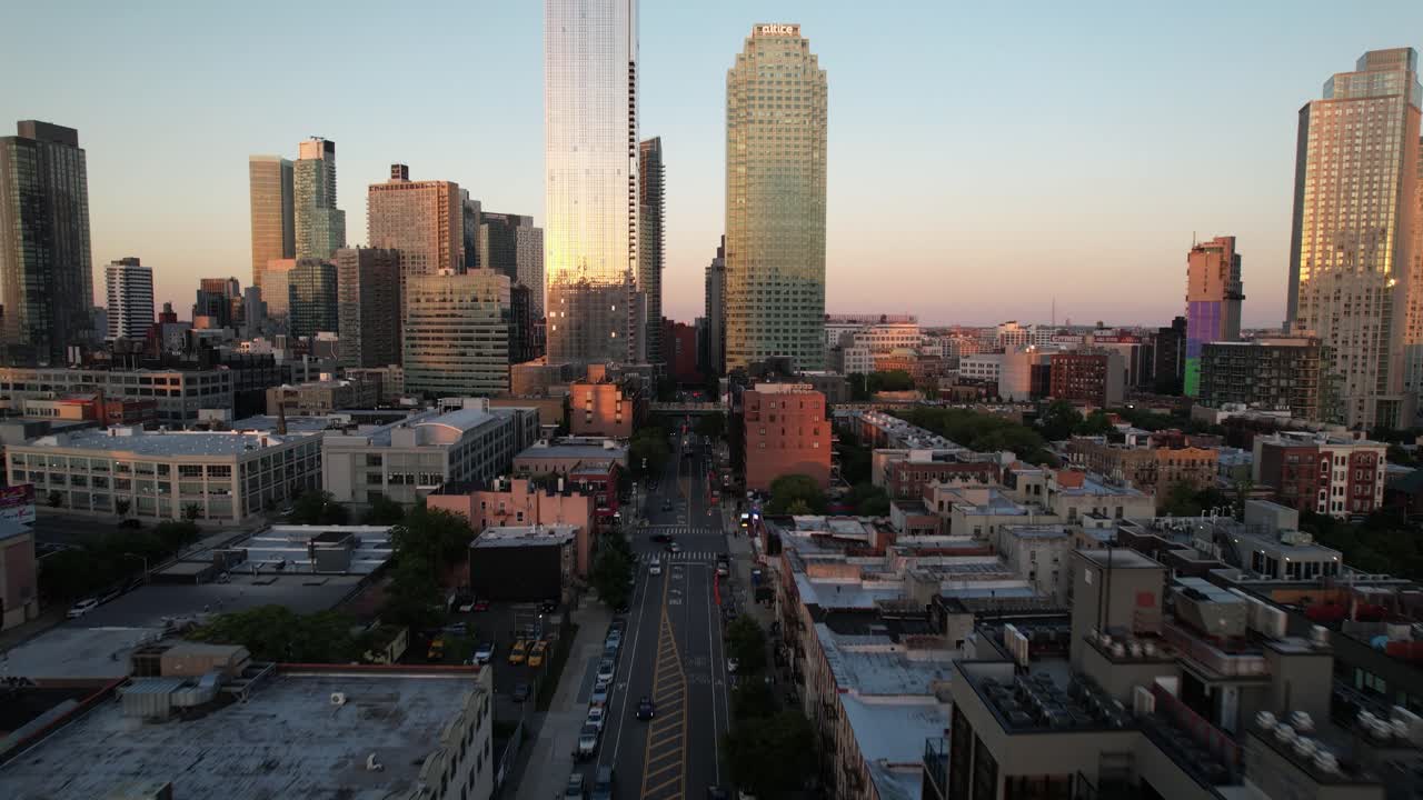 Aerial drone reveals Long Island City in Queens, New York at sunset