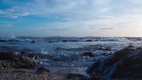 Waves-hitting-the-rocky-beach-in-slow-motion