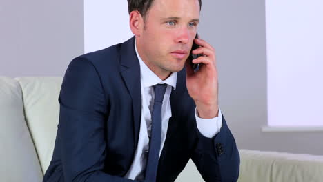 attractive businessman making a phone call