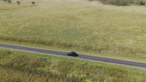 a car travels slowly on a rural road