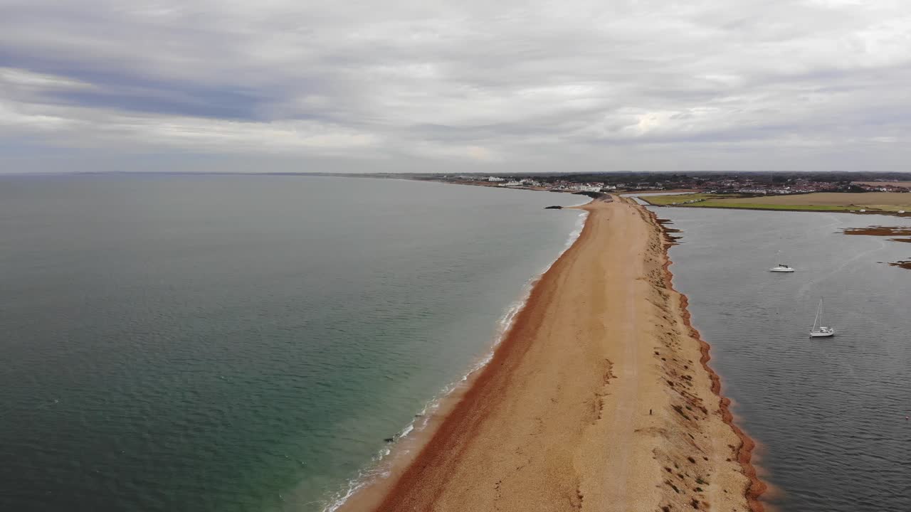 Aerial panning right shot of Hurst Spit Hampshire England UK