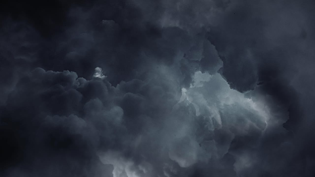4k thunderstorms, cumulonimbus clouds and lightning strikes moving in the dark sky
