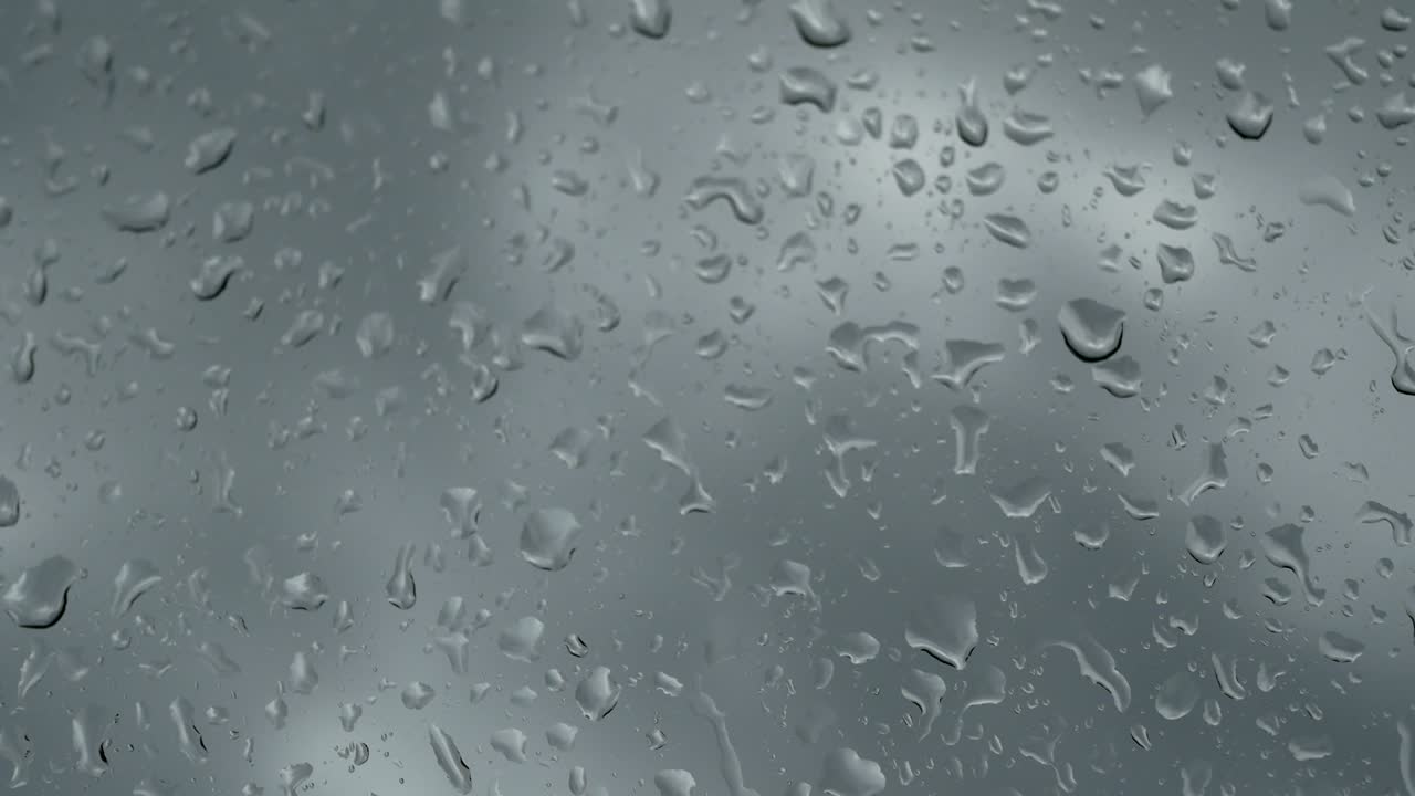 gotas de lluvia en la textura del vidrio, en hd completo