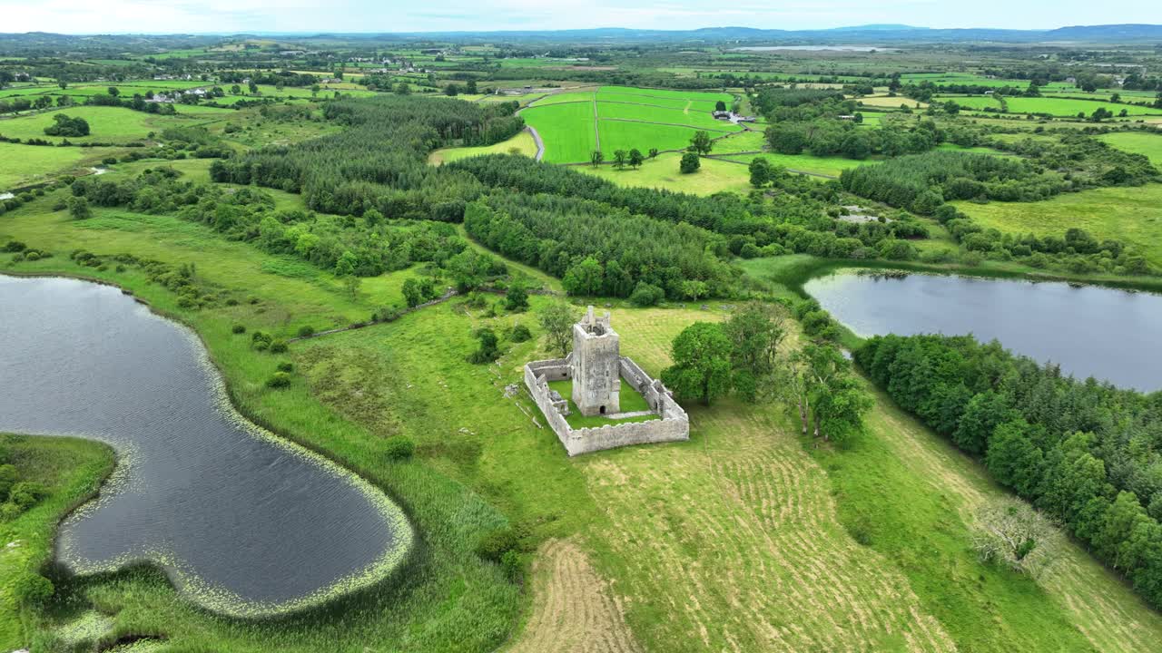 Irish Castles imposing Fiddaun castle co. Galway set in lush farmland between two lakes Ireland epic Locations and Landscapes in summer