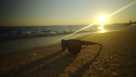 sunset on the beach with sunglasses