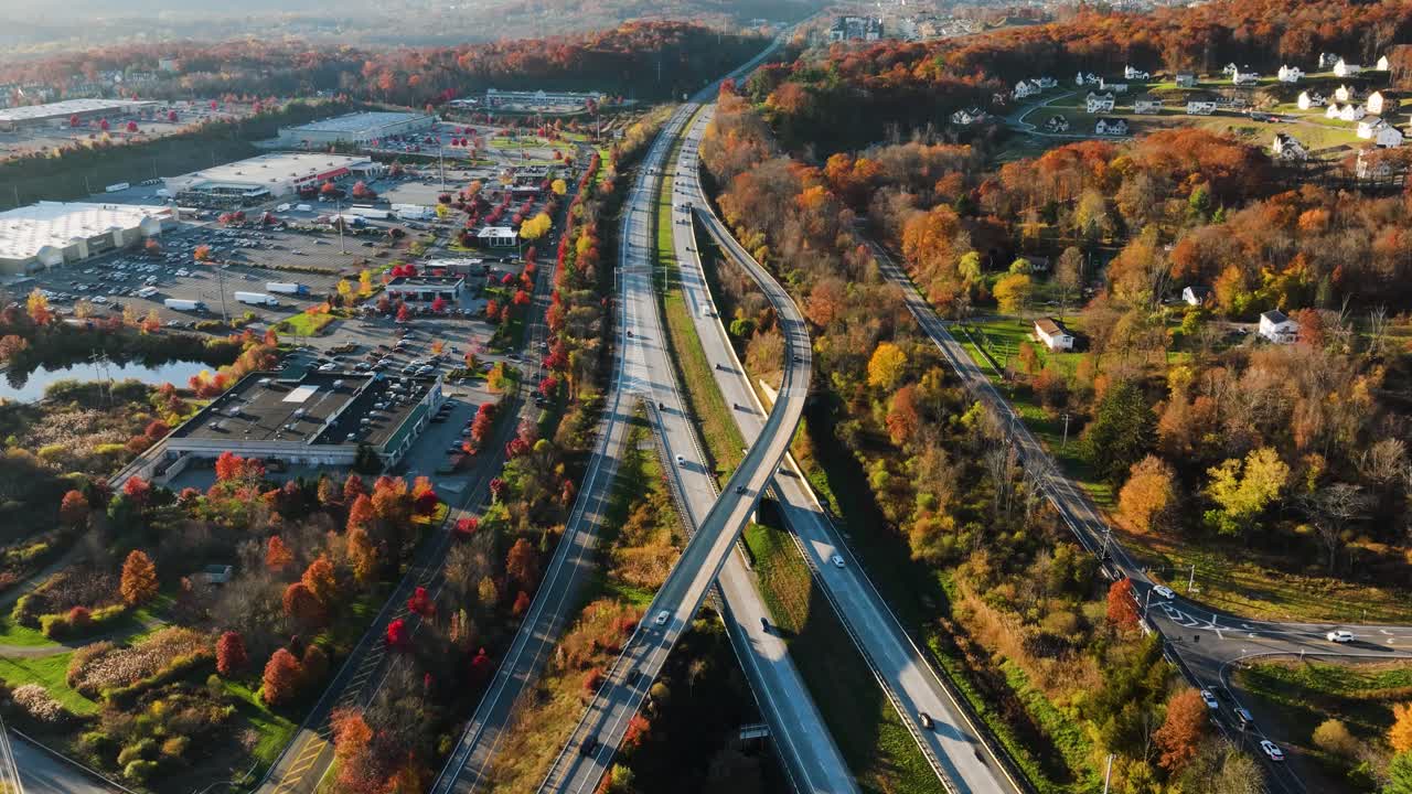 Afternoon aerial, drone, video of NY Route 17 just west of the diverging diamond interchange (DDI), located in Woodbury, NY, with a dolly move pulling