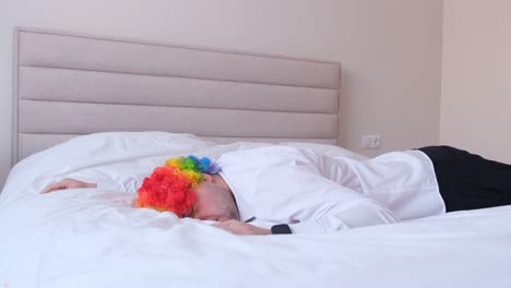 a clown sleeping in bed