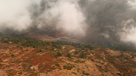 Clouds-Over-Coniferous-Valley-With-Flowing-River-In-Valle-Argentera,-Cuneo-Province,-Piemonte-Region,-Italy