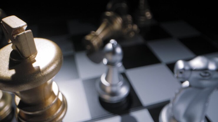 Shot sliding over a chessboard with a golden king piece standing proudly over the rest