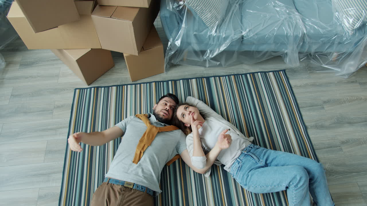 Couple Exhausted After Moving