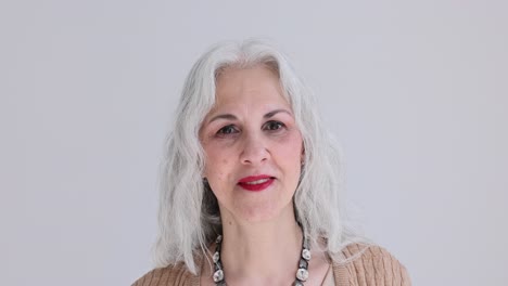 portrait of a senior woman with gray hair and red lipstick