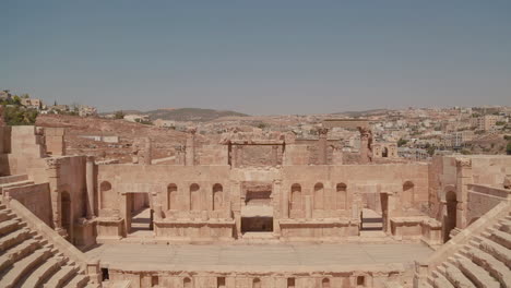 an establishing shot of amman jordan with roman ruins foreground 1