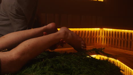 leg and foot massage in a sauna