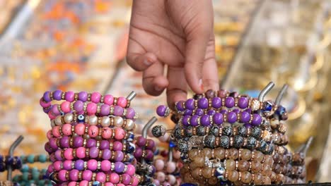 colorful beaded bracelets at a market