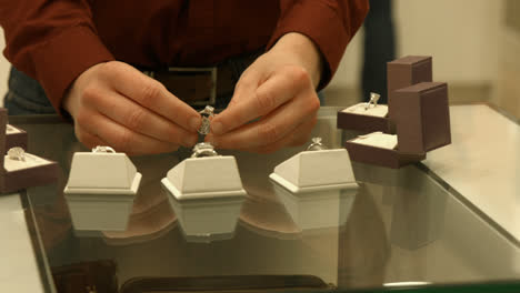 man looking at engagement ring