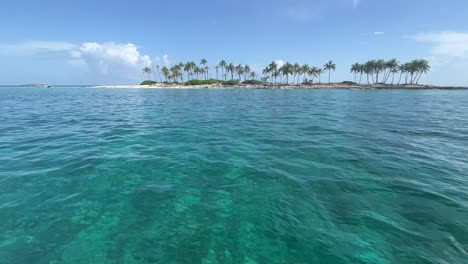 peaceful-view-from-the-sea-towards-the-island-with-palm-trees