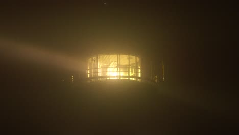 Close-up-of-the-Lighthouse-lamp-with-its-beams-penetrating-through-dense-fog