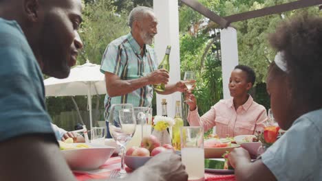 Happy-family-eating-together-at-table