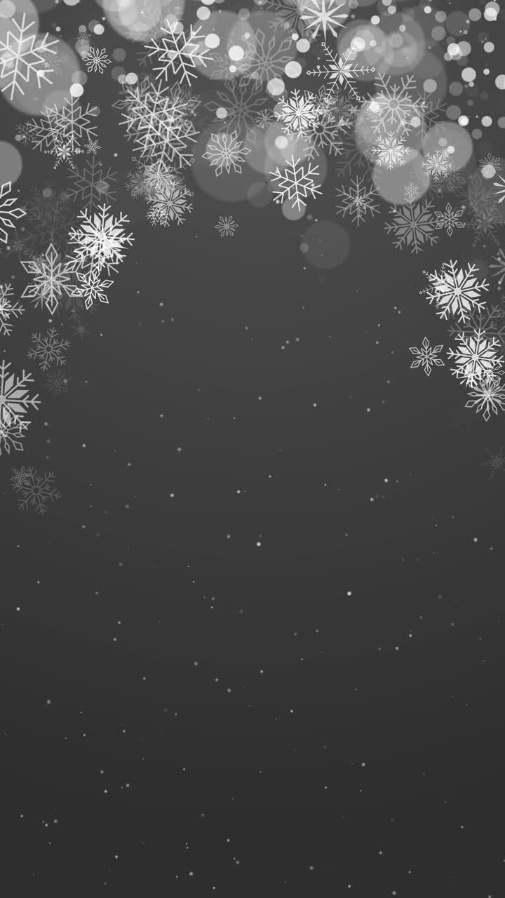Christmas dark grey background with white snowflakes for Merry Christmas festive animation. Copy space. Vertical video.