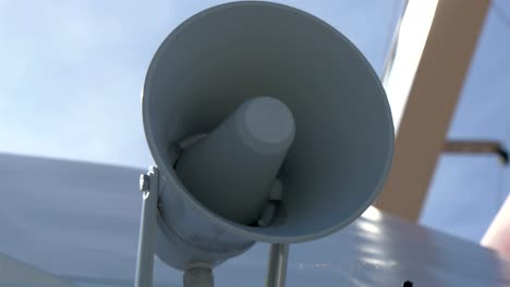 a white small megaphone attached on the yacht gh4 4k