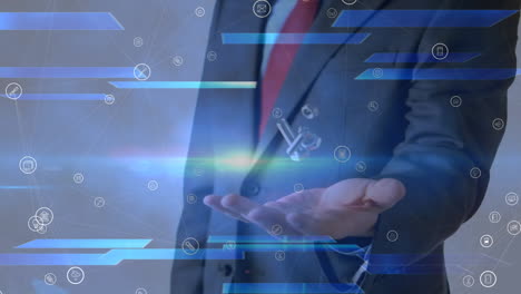 animation of network of media icons over businessman throwing and catching nuts and bolts