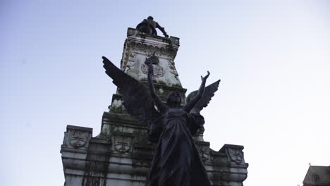 angel-sculpture-against-blue-clear-sky-and-epic-magic-sunshine,-apocalypse-end-of-there-world-concept