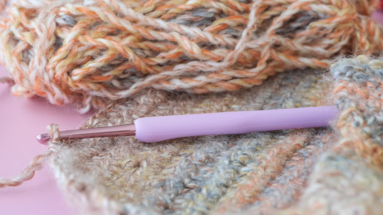 Crochet in Progress with Colorful Yarn and Purple Hook