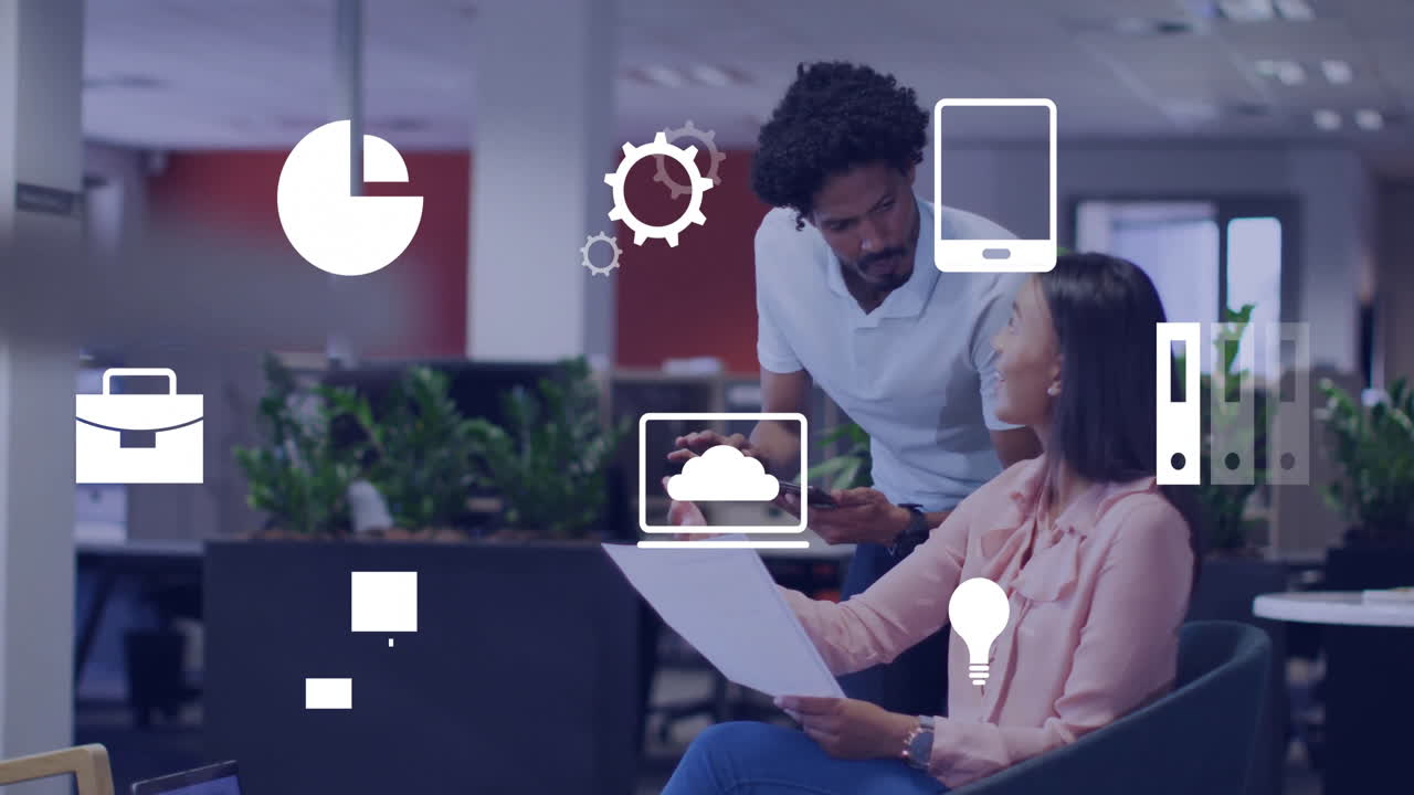 Business icons animation over colleagues discussing documents in modern office