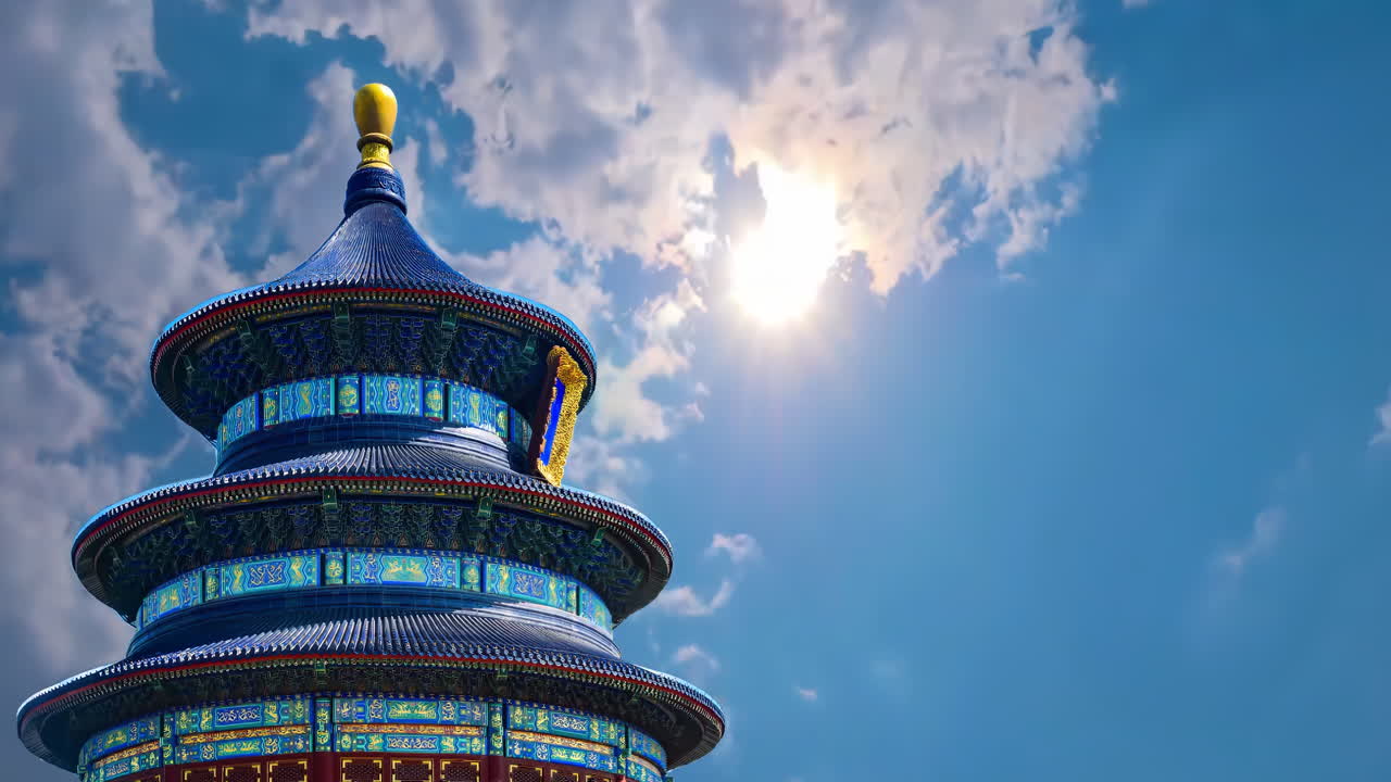 Traditional architecture tourist passing by Hall of Prayer for Good Harvests the largest building in Temple of Heaven Temple on foggy day in Beijing China. Ancient landmark, popular travel destination