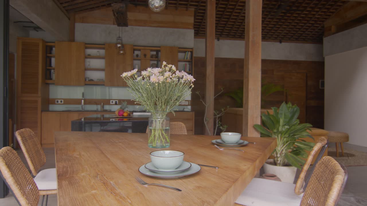 Comfortable country house with fresh wildflowers on triangular table