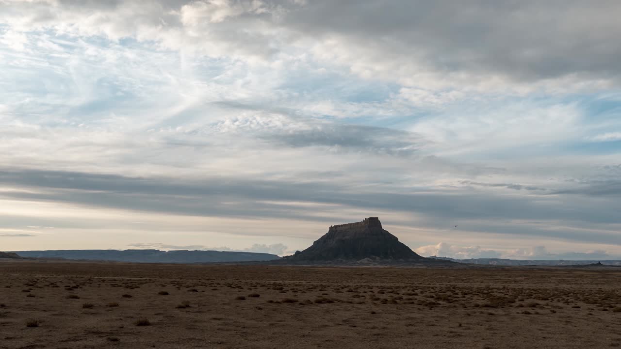 Daytime to sunset then twilight time lapse of Factory Butte in the Utah Caineville Desert