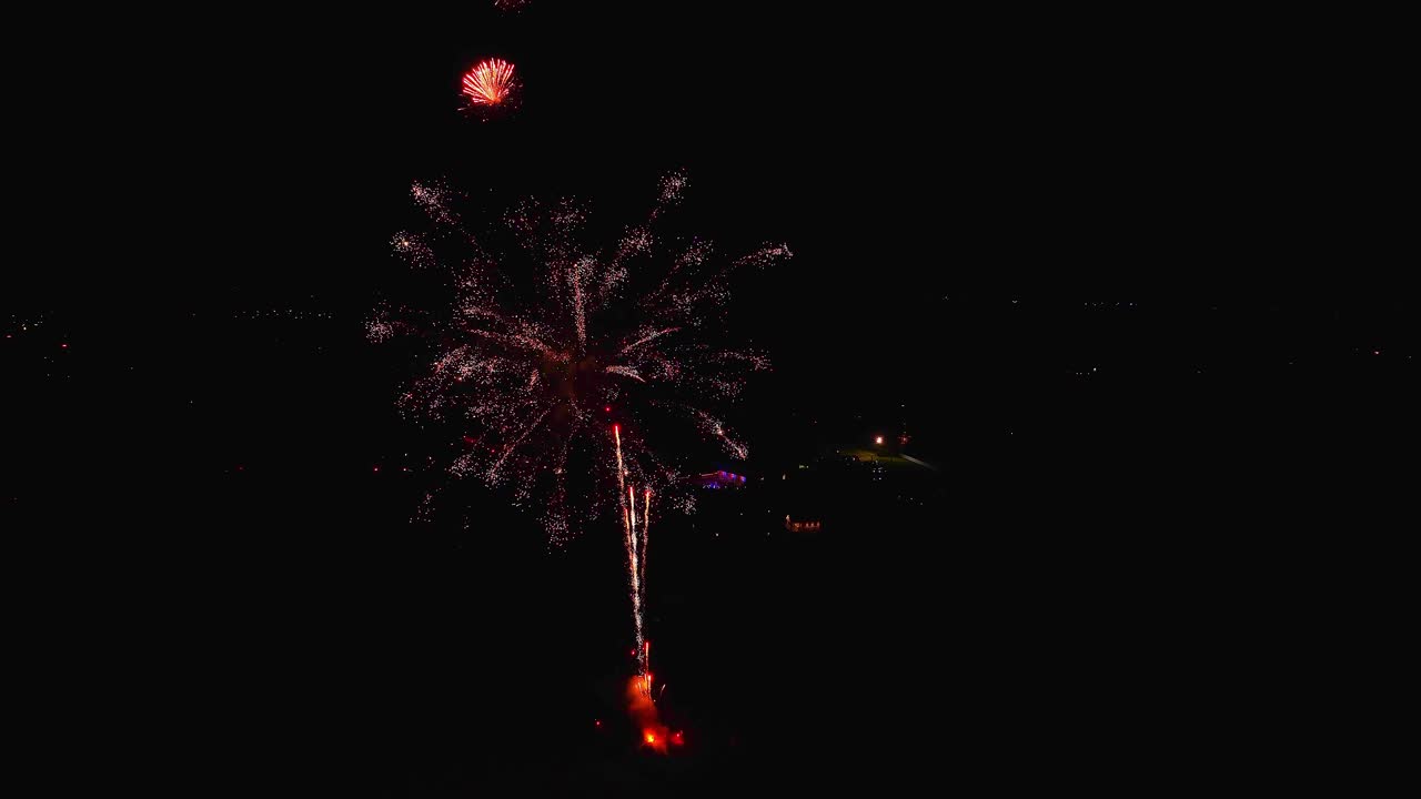Colorful fireworks light up the night sky during the celebration of the 250th birthday. Bright bursts fill the air as people gather to enjoy the show and mark this special occasion
