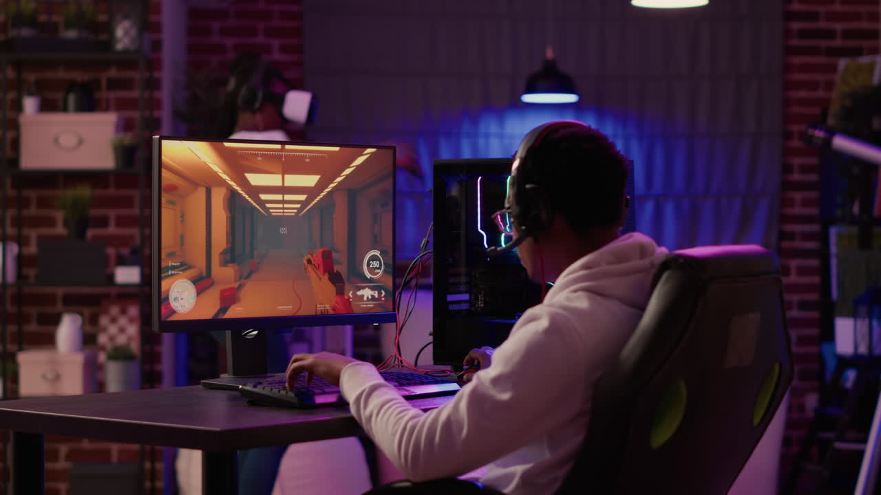 Adrican american man playing online first person shooter while gaming girl is fighting in virtual reality