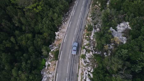 Old-vintage-car-driving-in-the-French-mountains-outside-Monaco