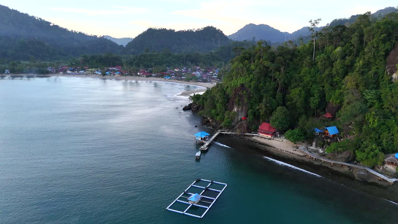 Drone aerial view of indonesian coastline padang west sumatra tropical ocean rainforest jungle trees