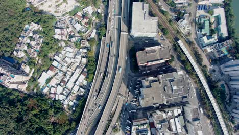 Downtown-Hong-Kong-city-skyscrapers-and-urban-traffic,-Aerial-view