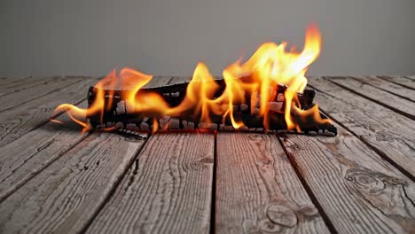 burning wood on a wooden surface