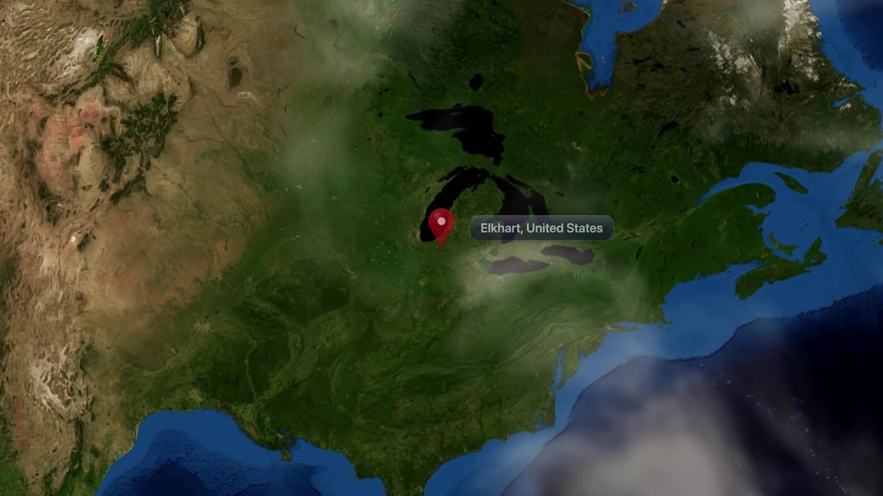 Satellite view zooms from outer space into North America, pinpointing Elkhart, Indiana, United States. Includes NASA public domain imagery.
