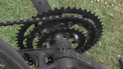 slow spinning crankset on upside down bike on grass