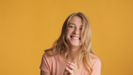 caucasian woman celebrating victory on camera.