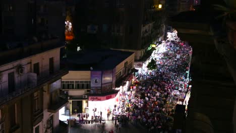 overhead view of a large nighttime protest rally in the stets of cairo egypt