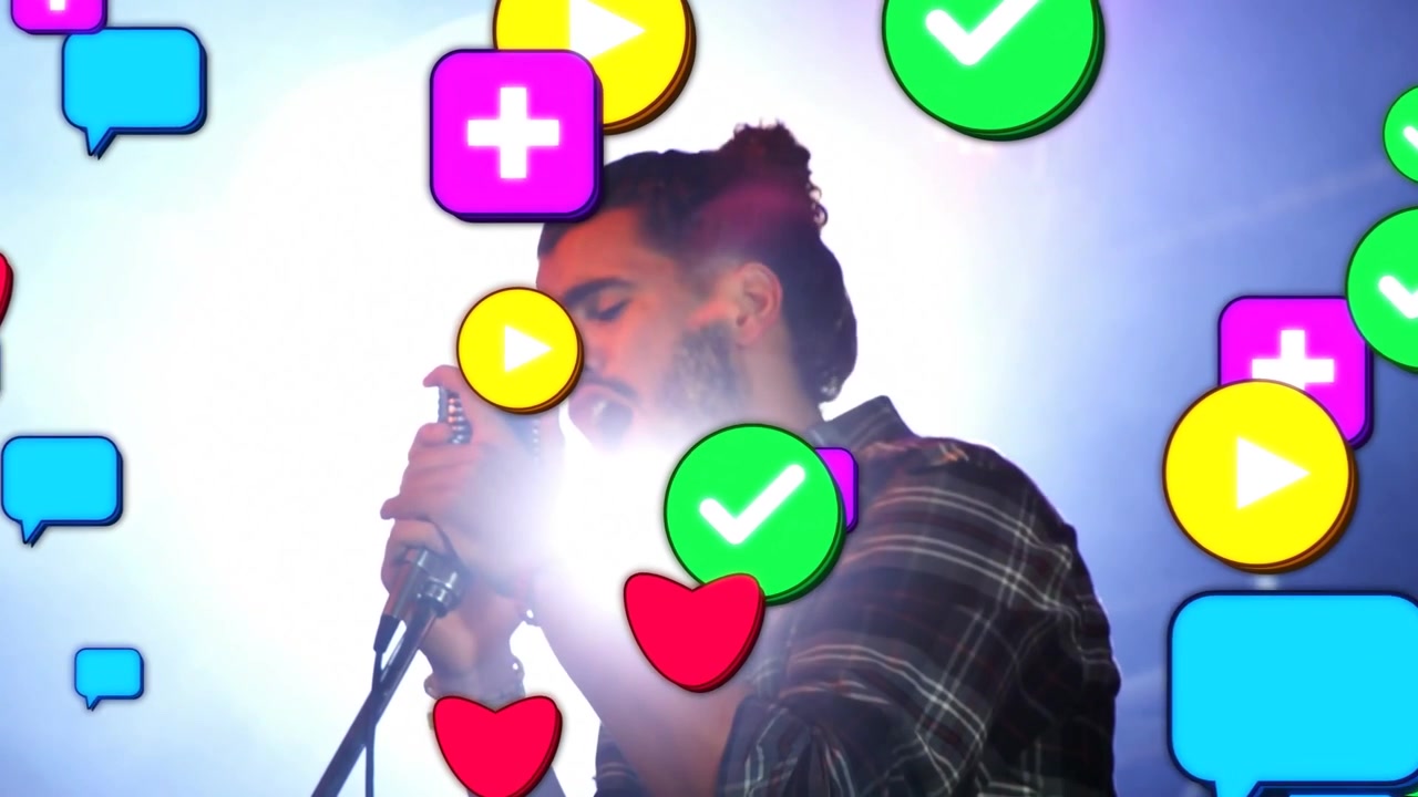 Male singer gripping mic, singing on stage, backlight bringing social icons showing music reactions