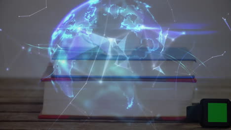 three hardcover books showing floating holographic globe above tabletop, featuring smartwatch