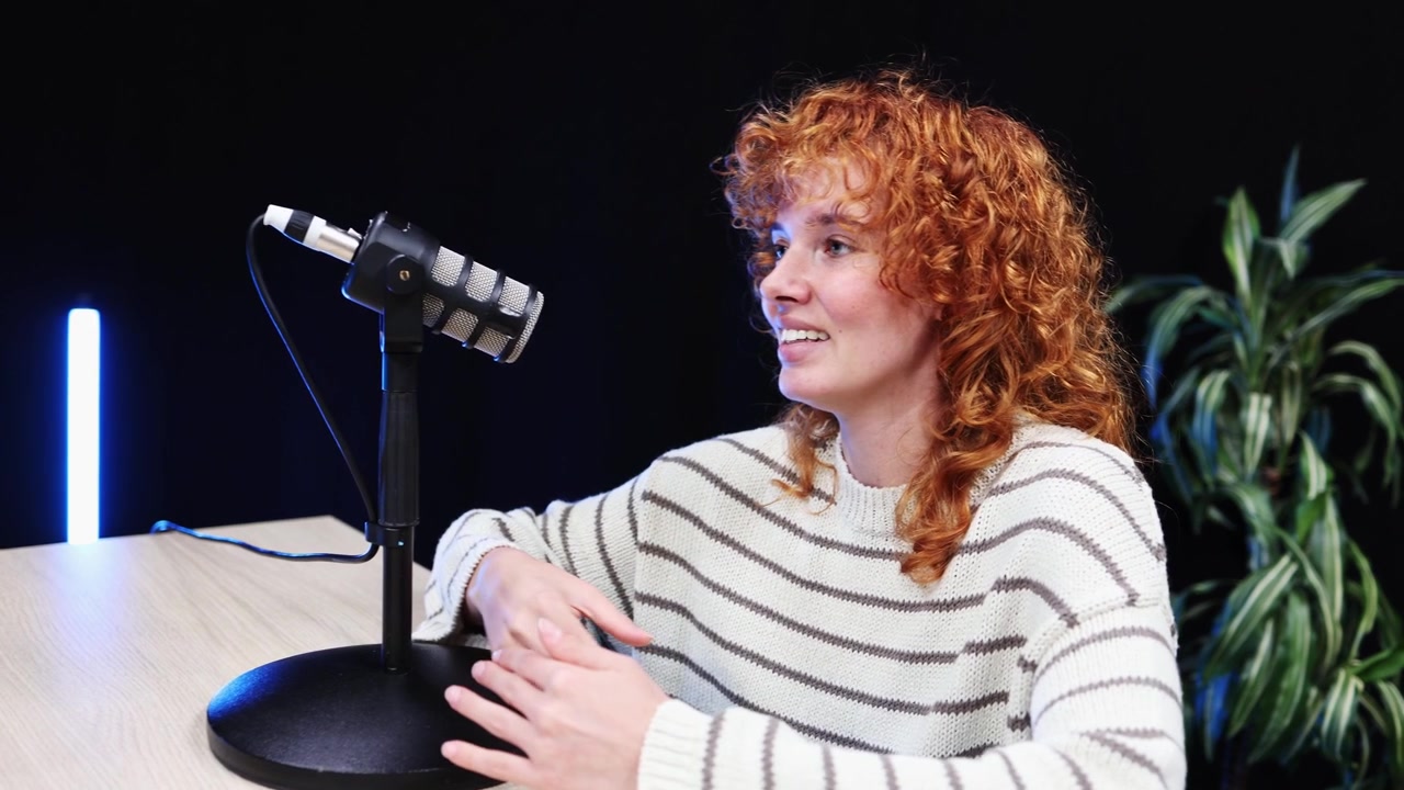 Young Man and Woman Recording Podcast Interview in Studio