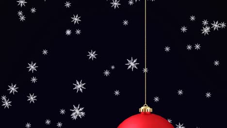 Animation-of-snow-falling-over-red-christmas-bauble-on-black-background