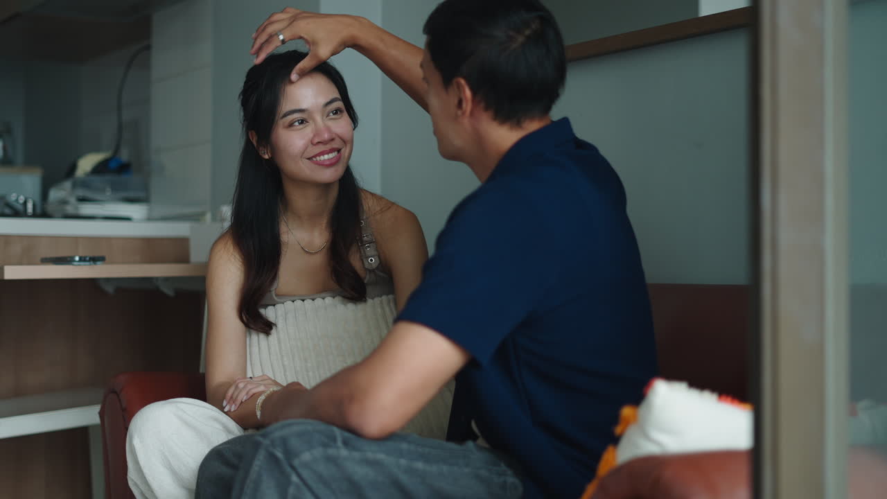 Couple interacting indoors