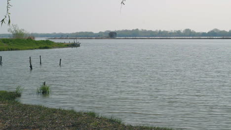 wide shot of hungarian lake tisza waves calmly