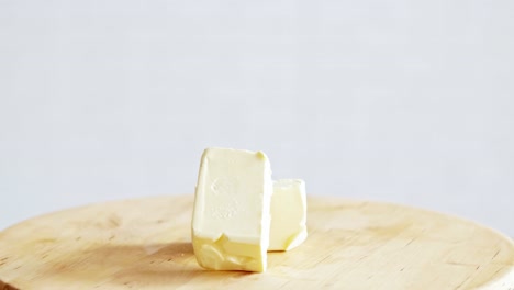 block of butter on the wooden table