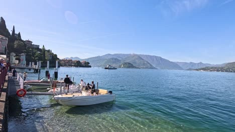 people enjoying a boat ride on lake como